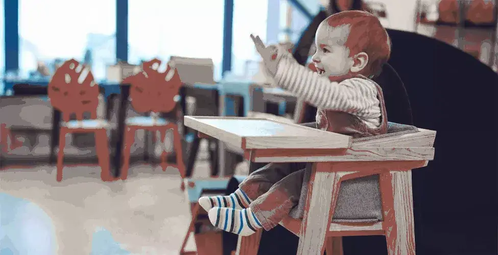 baby seated in high chair