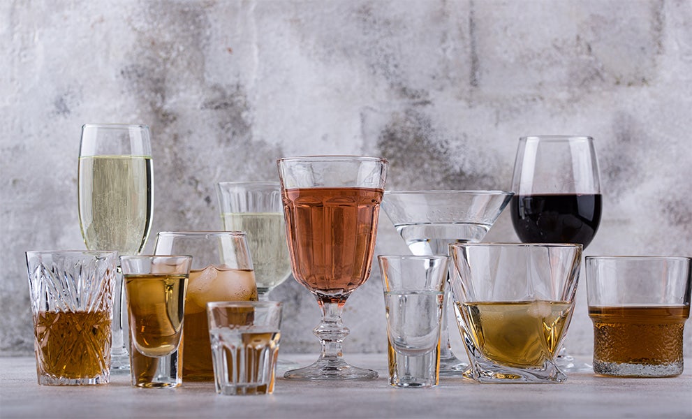 Different types of drinking glasses on table